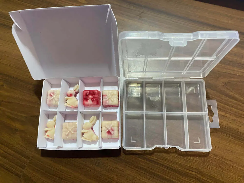 Clear plastic and white card 8-cell wax melt boxes side by side
