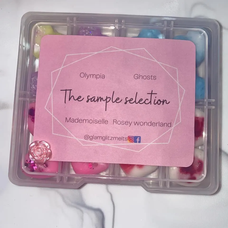 Clear wax melt sample box with a pink lid label listing the scents inside